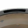 Close-up of a drum shell edge showing hardware and finish details.