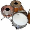 Six-piece drum set with copper and wood finishes for professional drumming.