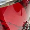 Red acrylic drum shell pack with chrome hardware and lugs.