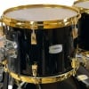 Yamaha PHX 22-inch black shell drum with gold hardware.
