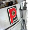 Close-up of Premier 1036 chrome snare drum with badge detail.
