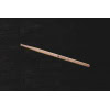 Hickory drumstick with barrel tip on dark background.