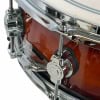 Close-up of drum shell with hardware and chrome fittings.