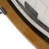 Close-up of drum shell with brown finish and hardware details.
