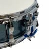 Close-up of a snare drum with chrome hardware and blue accents.