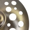 Close-up of Paiste PSTX 18in Swiss Crash cymbal with holes.