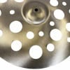 Close-up of Paiste PSTX 18in Swiss Crash cymbal with circular holes.
