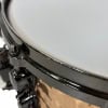 Close-up of Mapex Black Panther 14x5.5in snare drum rim and shell.