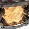Close-up of Mapex Black Panther 14x5.5in snare drum with hammered bronze finish.