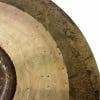 Close-up of a vintage 20-inch sand finish ride cymbal with patina and wear marks.