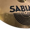 Close-up of Sabian cymbal with black logo and concentric circle design.