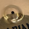 Close-up of Zildjian ZXT 14in solid hi-hats cymbals with reflective surface.