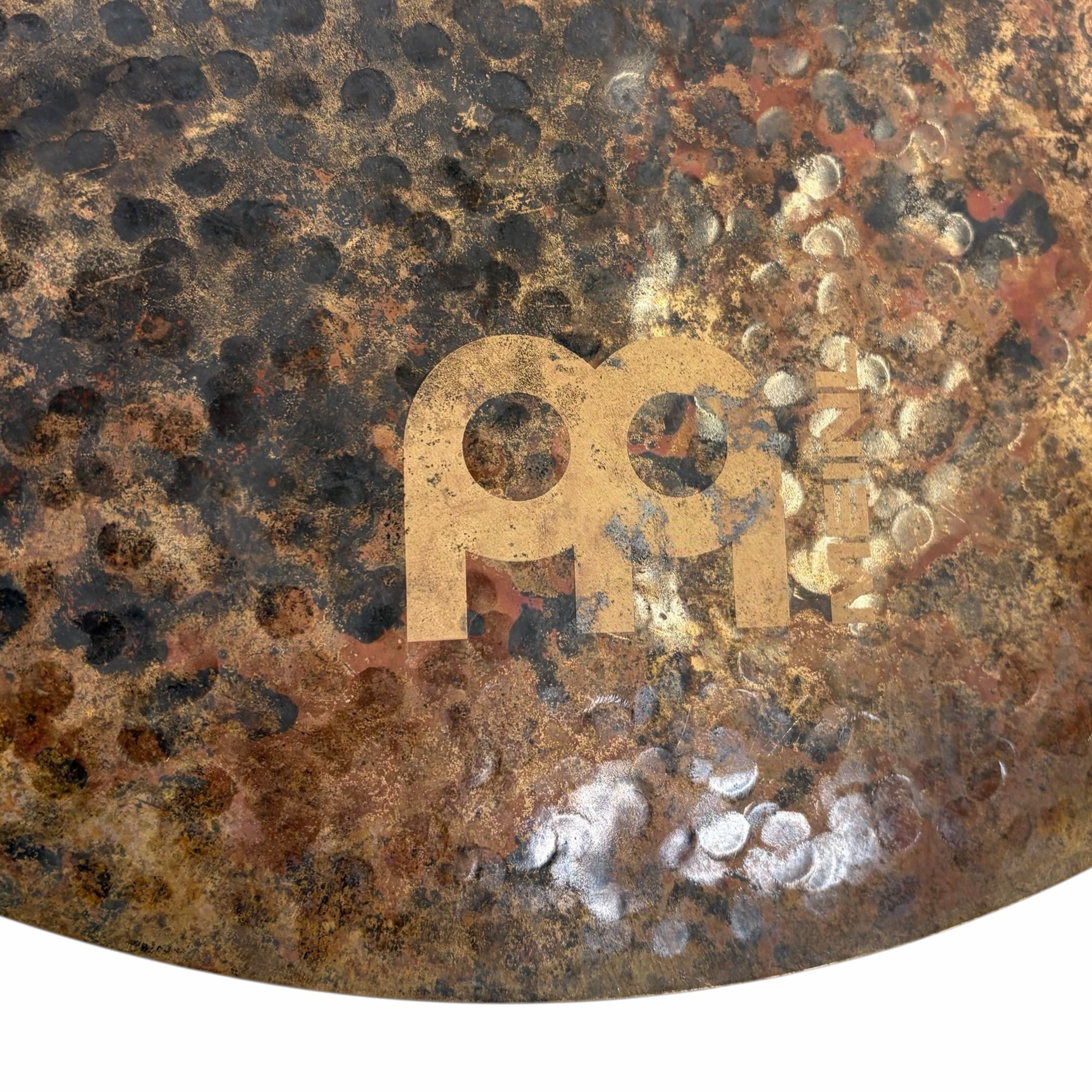 Rusty crash cymbal with Meinl logo, textured surface, and patina.