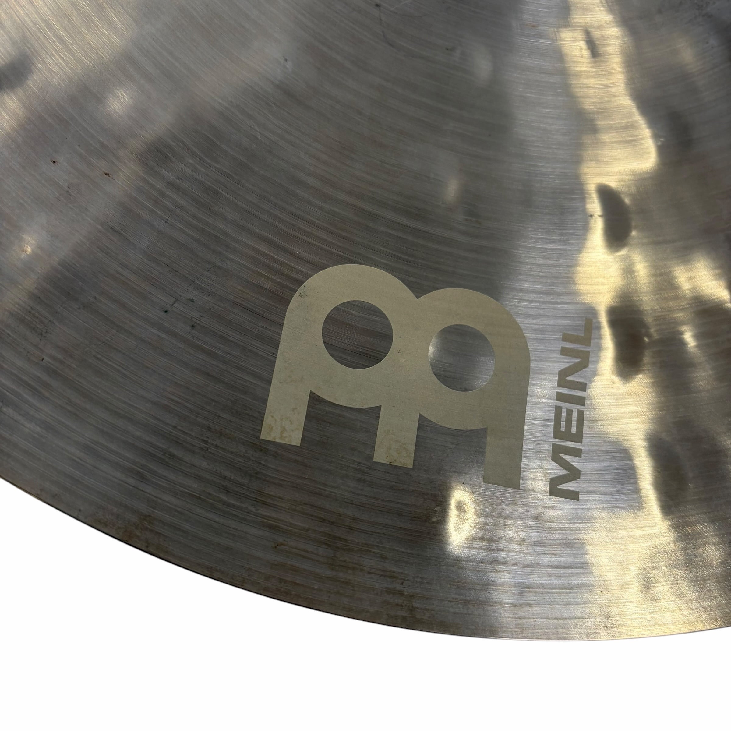 Close-up of Meinl Byzance Extra Dry 18in crash cymbal surface with logo.