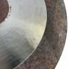 Close-up of a vintage 22-inch sand ride cymbal with textured surface and patina.