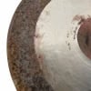 Close-up of a vintage 22-inch sand ride cymbal with a textured surface.