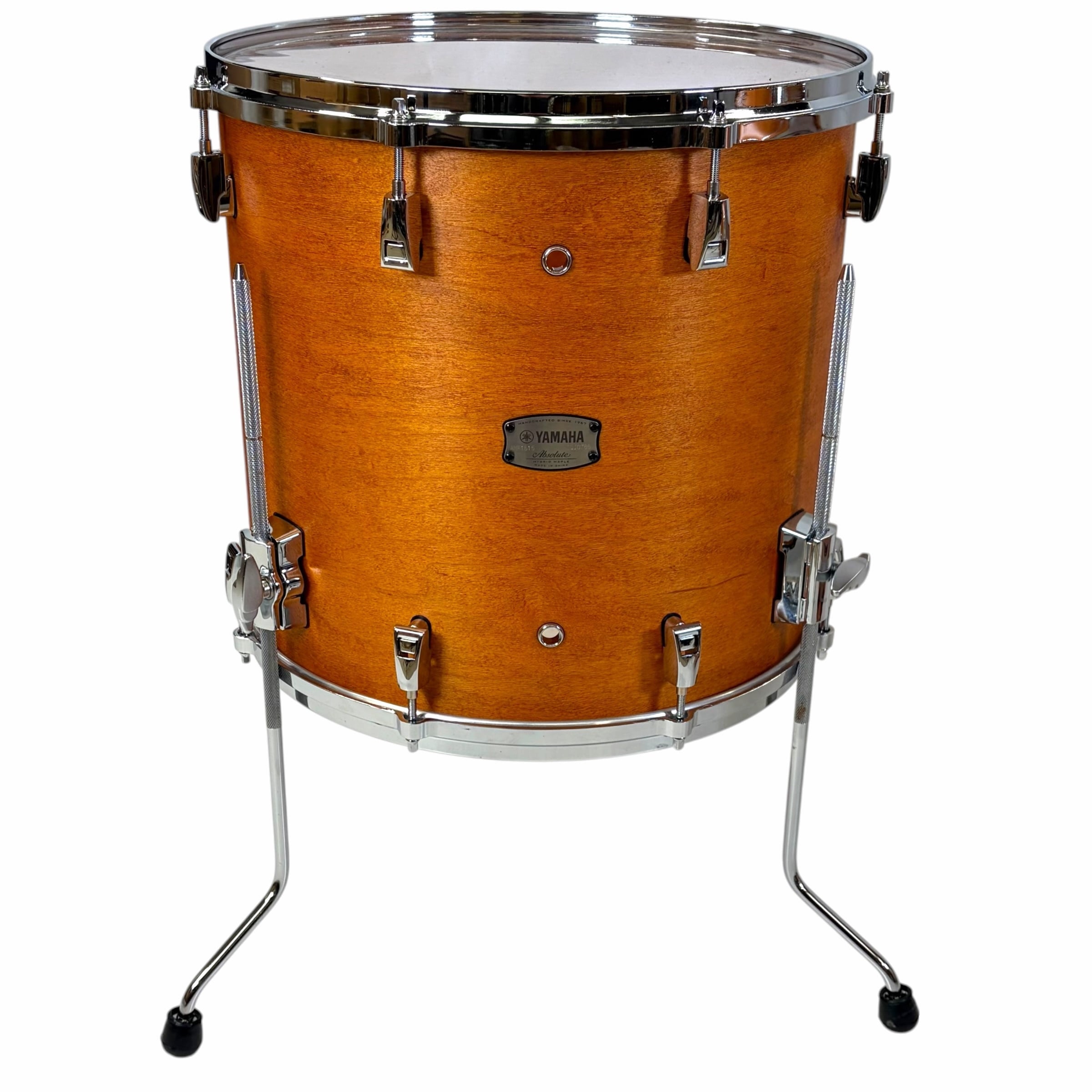 Yamaha Absolute Hybrid Maple 22in drum shell on stand in vintage natural finish.