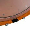 Close-up of a vintage natural Yamaha hybrid maple shell clock with black and silver details.