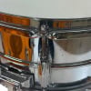 Close-up of chrome drum hardware with tension rod and lug.