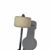 Drum accessory wheel with stand and white felt pad.