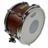 Tama snare drum with brown wood shell and chrome hardware.