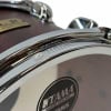 Tama Storch snare drum close-up chrome hardware with Tama badge.