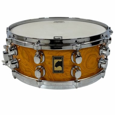 Mapex Black Panther snare drum with quilted wood finish and chrome hardware.