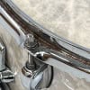 Close-up of chrome drum hoop, tension rod and lugs on Birch snare drum with shiny chrome finish.