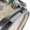 Close-up of Premier Birch snare drum chrome hardware and hammered shell.