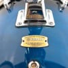 Close-up of Yamaha Stage Custom drum shell with badge and hardware.