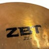 Close-up of Zildjian ZBT 18-inch crash cymbal with logo and size details.