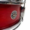 Close-up of Gretsch Catalina 14x5in snare drum in crimson burst finish.