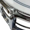 Close-up of Pearl Sensitine Steel 14x6.5in snare drum with chrome finish.