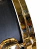 Close-up of Mapex Black Panther 14x5.5in maple snare drum with gold hardware.