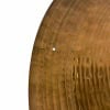 Detailed view of a wooden drum with visible grain and small imperfections.